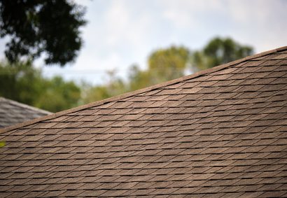 Roofer repairing flashing on a Highlands Ranch home